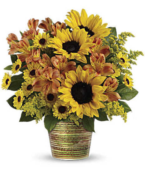 Orange alstroemeria and golden yellow sunflowers combine to make a magnificent statement