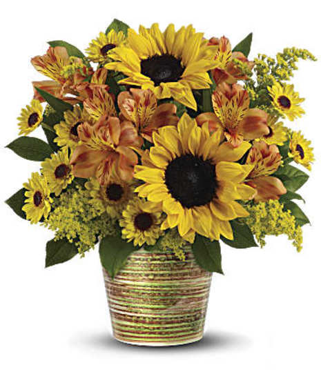 Orange alstroemeria and golden yellow sunflowers combine to make a magnificent statement