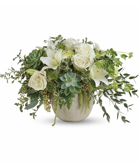 White flowers, succulents and greenery in a charming container