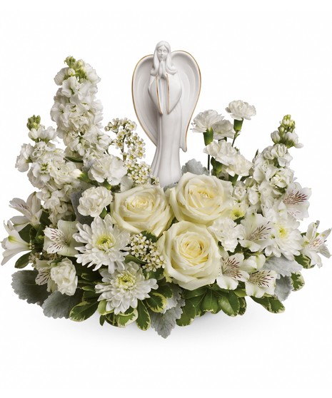 A wonderfully designed smypathy bouquet with  a graceful angel resting amongst fragrant, snow white roses, and Alstroemeria