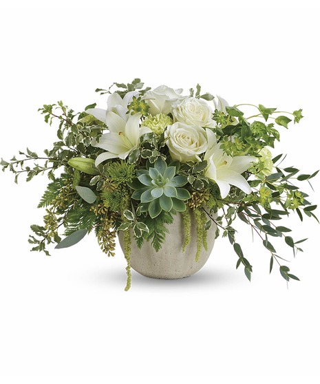 White flowers, succulents and greenery in a charming container